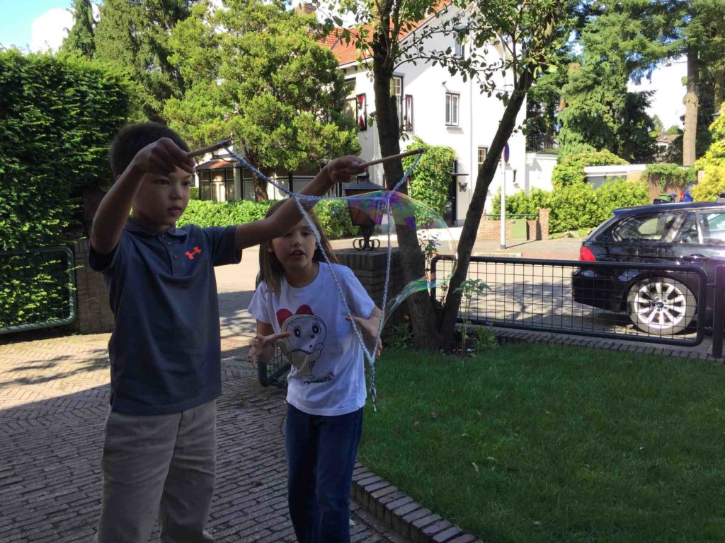 Buds. Blowing big bubbles with a rope and a washer.