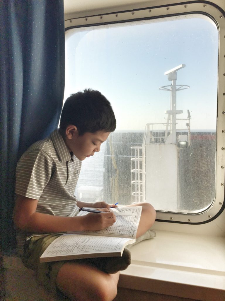 Jake working on Italian word games, on the ferry from Patras to Brindisi.