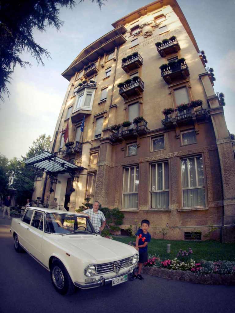 Nice car and hotel. Kid is pretty special too. The Palace Grand Hotel, Varese.