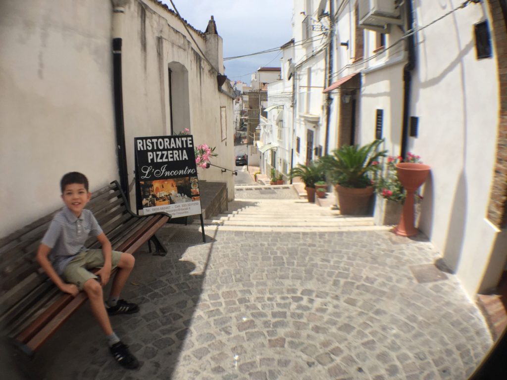 Tiny town on top of a hill in Italy, with our lunch pizzeria.