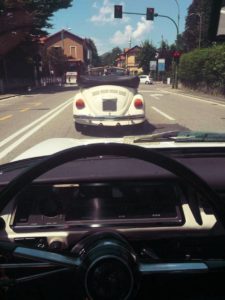 Enrico is pretty cool driving a convertible Beetle. I follow him to Mario's shop.