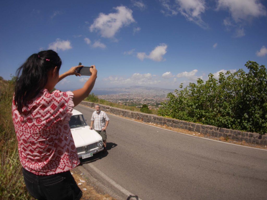 Aey taking a picture of the Alfa Romeo and dad