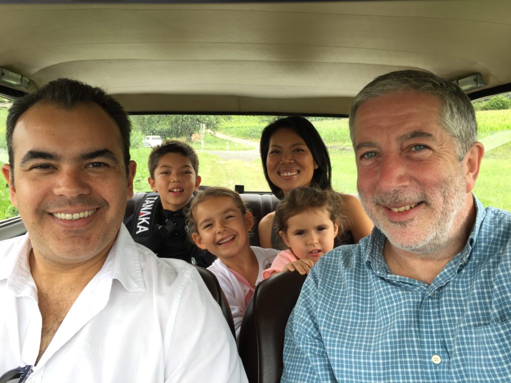 Good friends in a little car in the countryside.