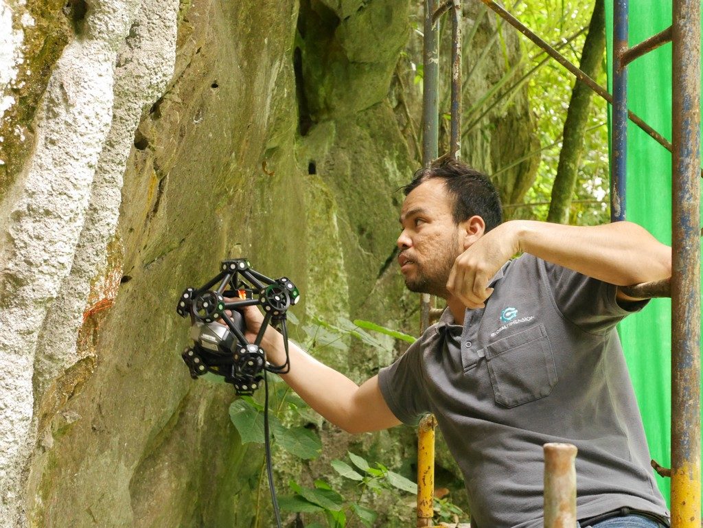 A little acrobatics. Easier to lean over than to repositioning 3 floors of scaffolding. The 3D laser scanner is expensive, so we need to be careful.