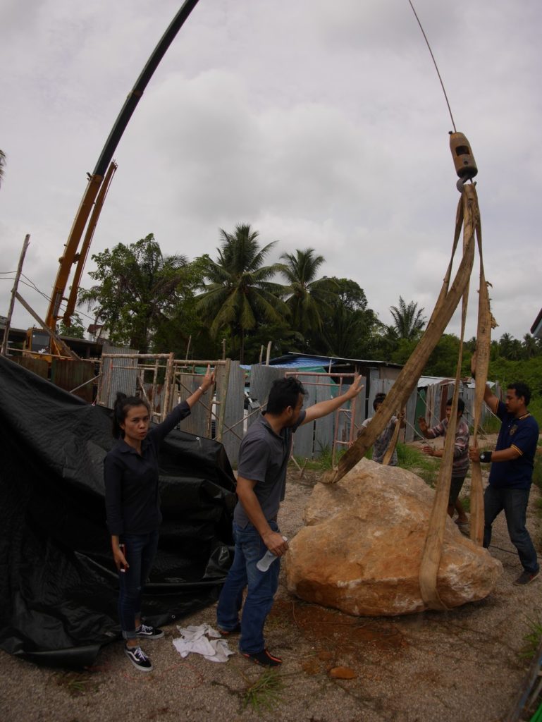 Orn giving instructions to lift the rock. Yes ma'am.