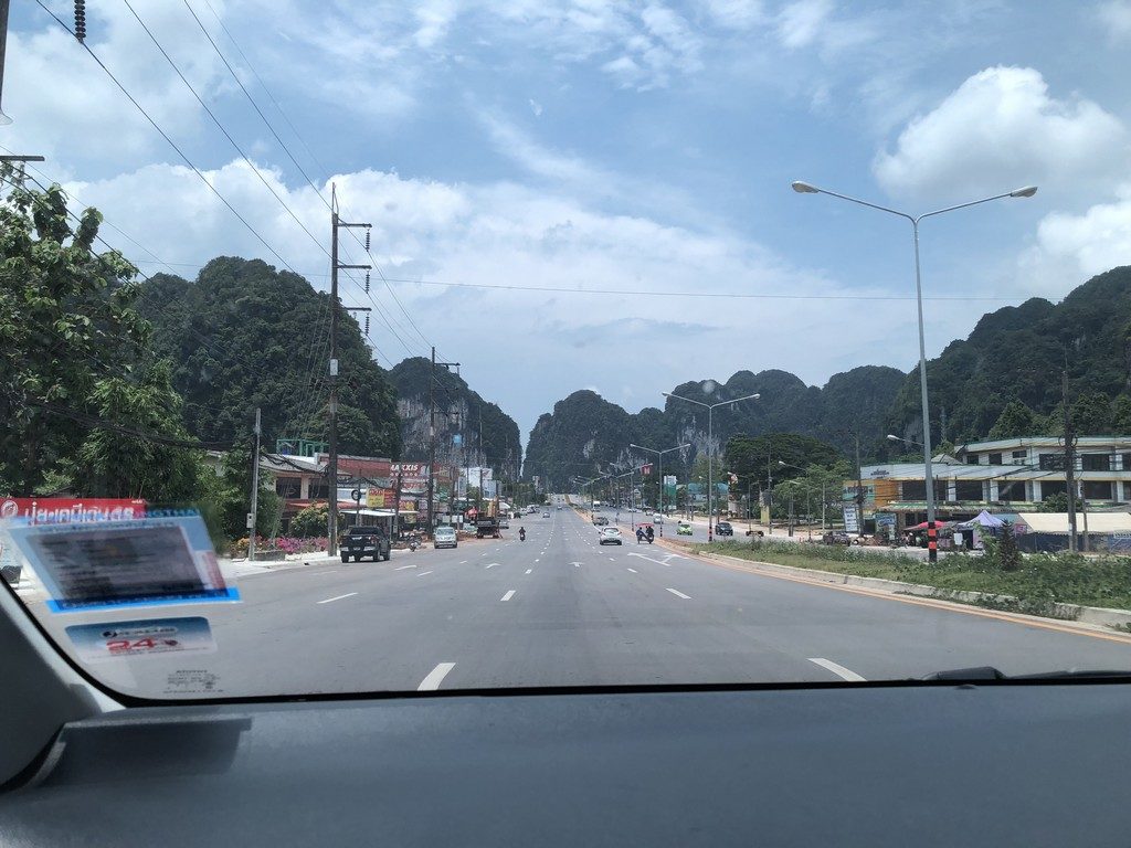 Typical scene on a road in Krabi. Stunning mountain formations are everywhere.